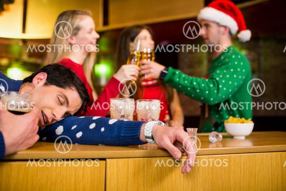 Smiling friends with christmas accessory