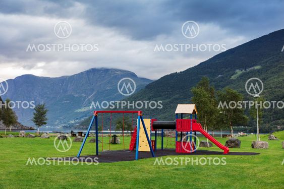 playground in the park on the shore of the fjord