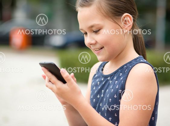 Little girl is using smartphone