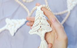 Handmade crochet new year decoration in woman hands....