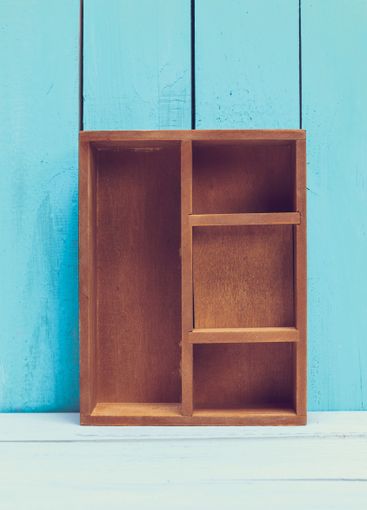 Cozy pastel wooden home decor objects on blue background