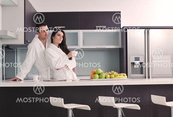 young couple have fun in modern kitchen