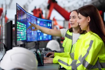 Female engineer developing automated manufacturing...