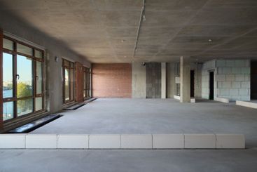 The modern interior has ample natural light and stylish...