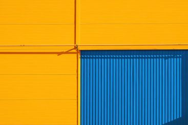 Detail of an industrial warehouse building with yellow...