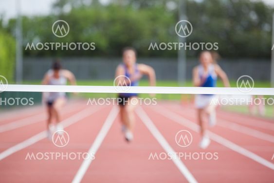 Athletes running towards finish line