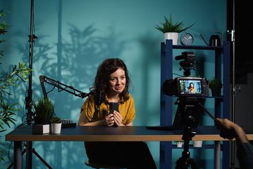 Woman filming video reacting to romantic text messages...