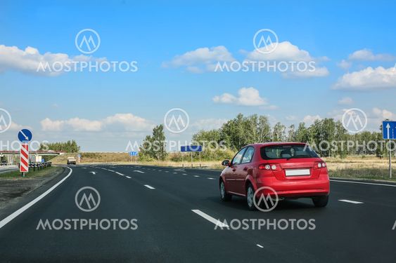 car goes on country highway