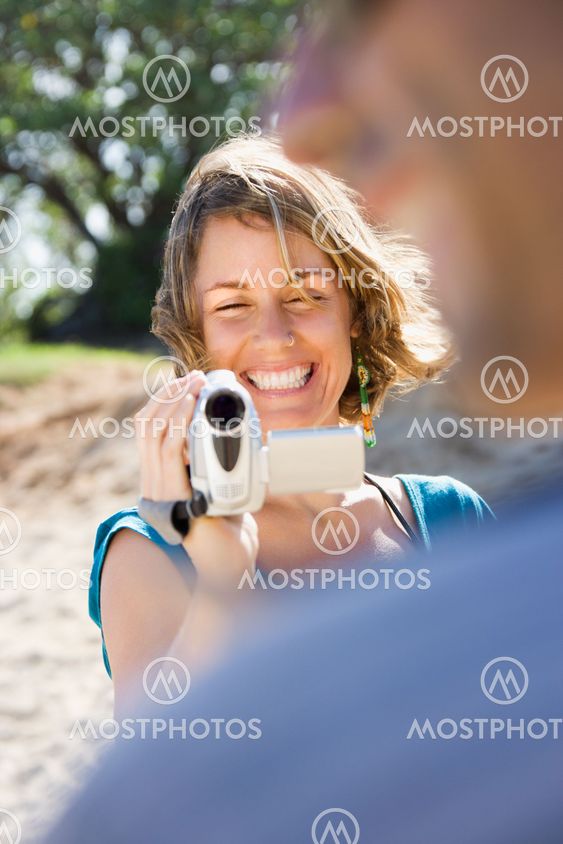 Couple with video camera.