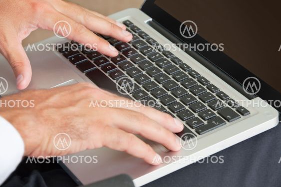 Hands Typing On Keyboard