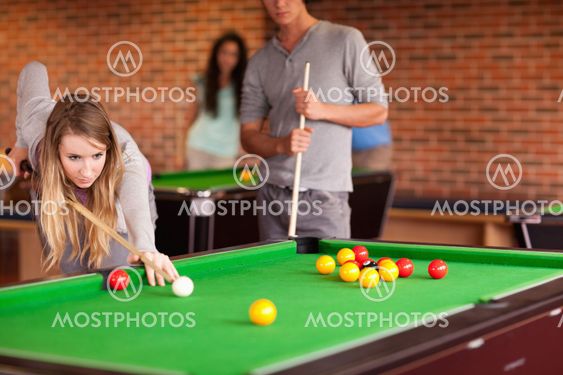 Friends playing snooker