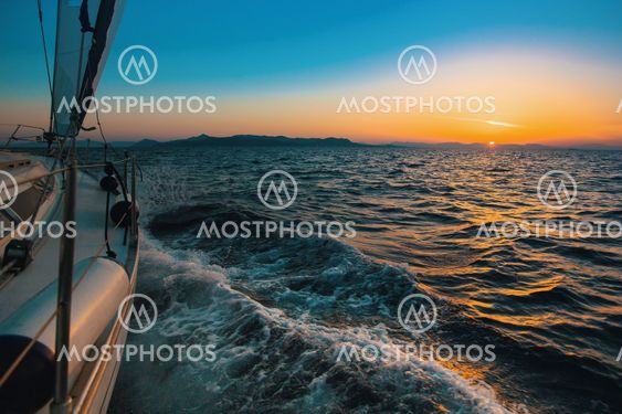 Sailing ship yachts in the open Sea at evening. Luxury boats.