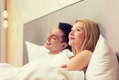 happy couple dreaming in bed