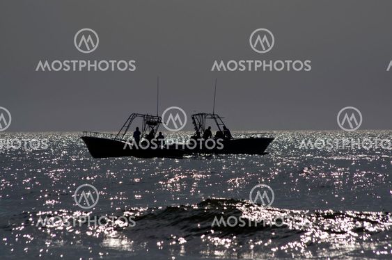 Boats in silhouette