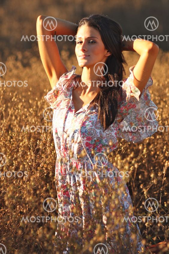 Beautiful Woman on a Field in Summertime