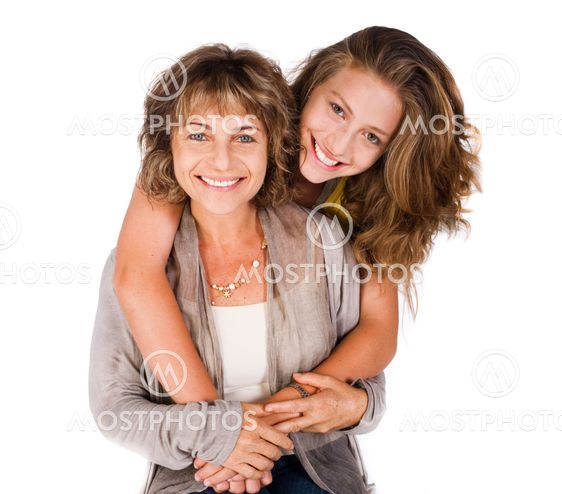 Pretty daughter hugging her mom from back
