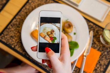 Taking a picture of the food