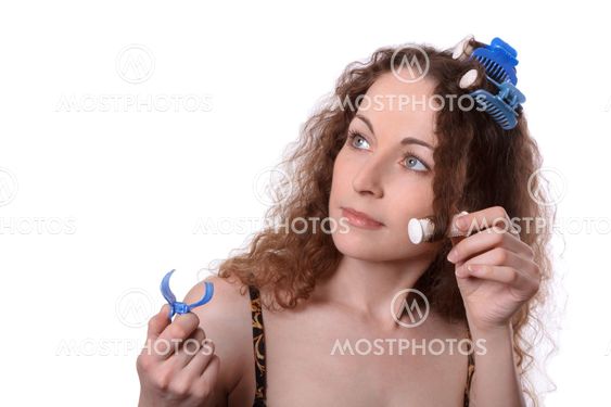 Woman in hair rollers isolated on white