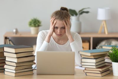 Stressed college student tired of hard learning with...