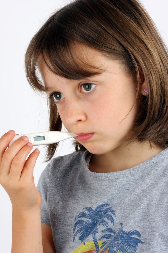 Girl taking her temperature