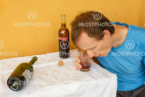 a drunk man shumped on the table