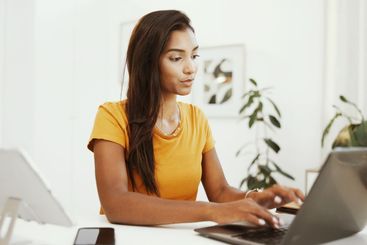 Remote work, inspiration and laptop with woman typing in...