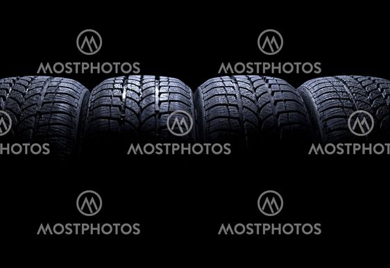 Car tires isolated on black background