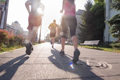 group of young people jogging in the city