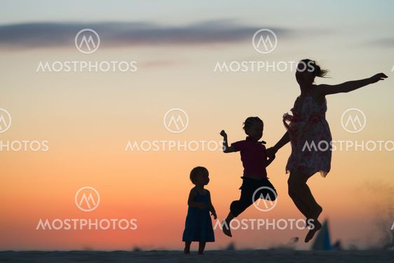 Family fun at sunset beach