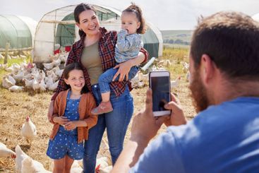 Farm, animals and photo of parents with children in...