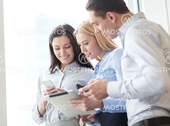 business team working with tablet pcs in office