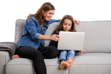 Mother teaching her little daughter