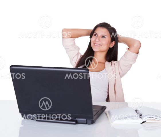Woman sitting working at her laptop