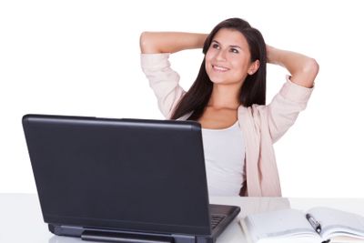 Woman sitting working at her laptop