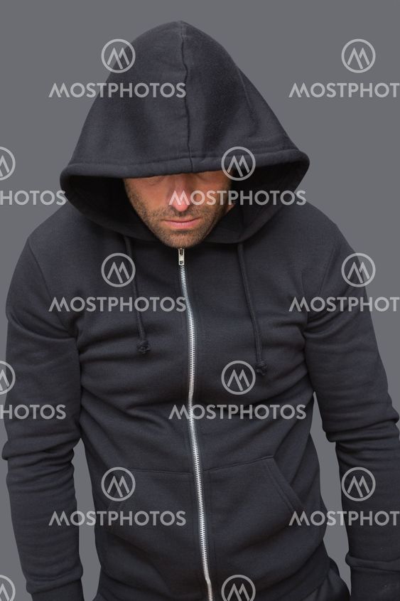Criminal in balaclava looking at camera