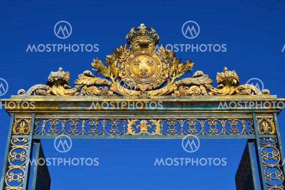 Golden Main Gates of the Versailles Palace. The Palace Versailles was a royal chateau. It was added to the UNESCO list of World Heritage Sites. Paris, France.