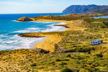 Coast view with camper rv camping on sea shore, Spain
