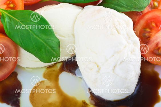 mozzarella tomato and basil on white