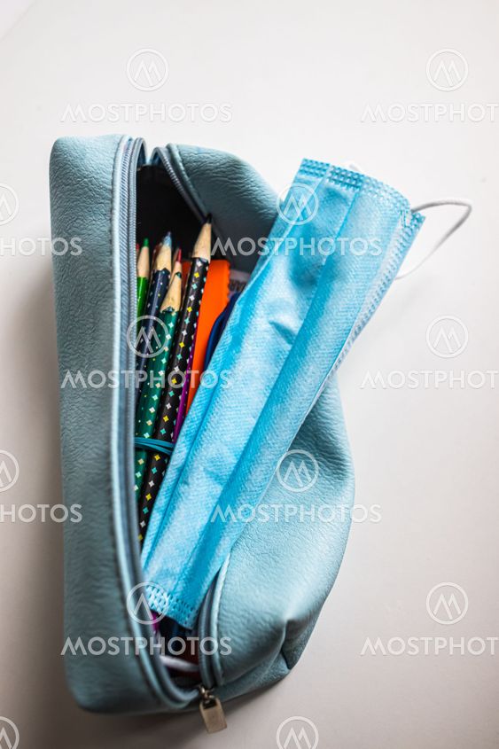 Pencil-case with protective face medical mask in on...