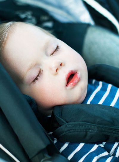 Baby Boy Sleeping in Automobile Seat