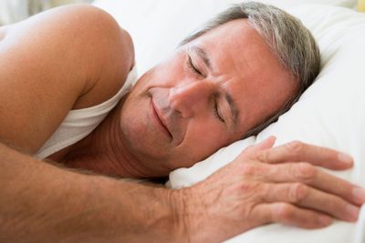Man lying in bed sleeping