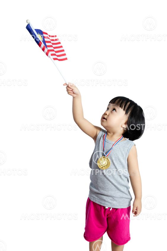 Asian Chinese little girl holding Malaysia Flag with gold...