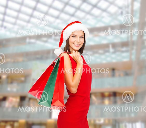 woman in red dress with shopping bags