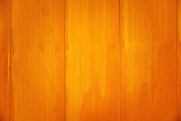 Industrial warehouse wall painted in yellow as background