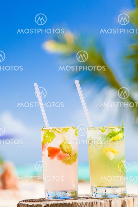 back view of couple sitting on a tropical beach in Barbados
