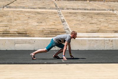 Athlete in the starting position before the race on the...
