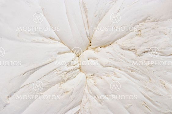 Mixed dough background from above that stands to leaven