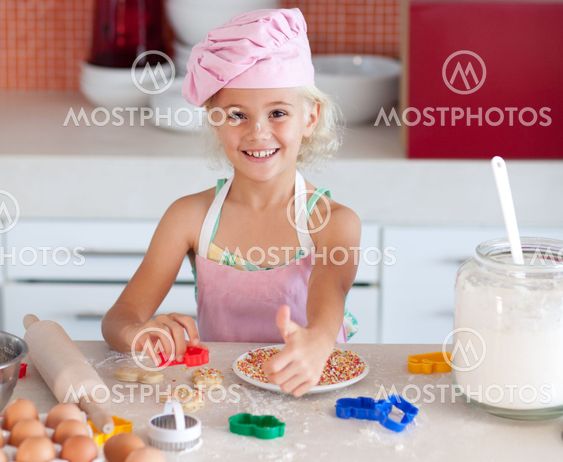 Girl in the kitchen thumb up