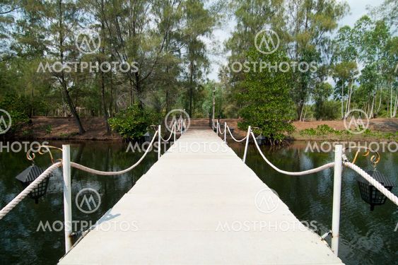 stone walkway on water in the park