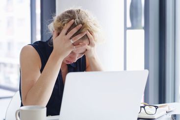 Stress, business woman and laptop with headache for...